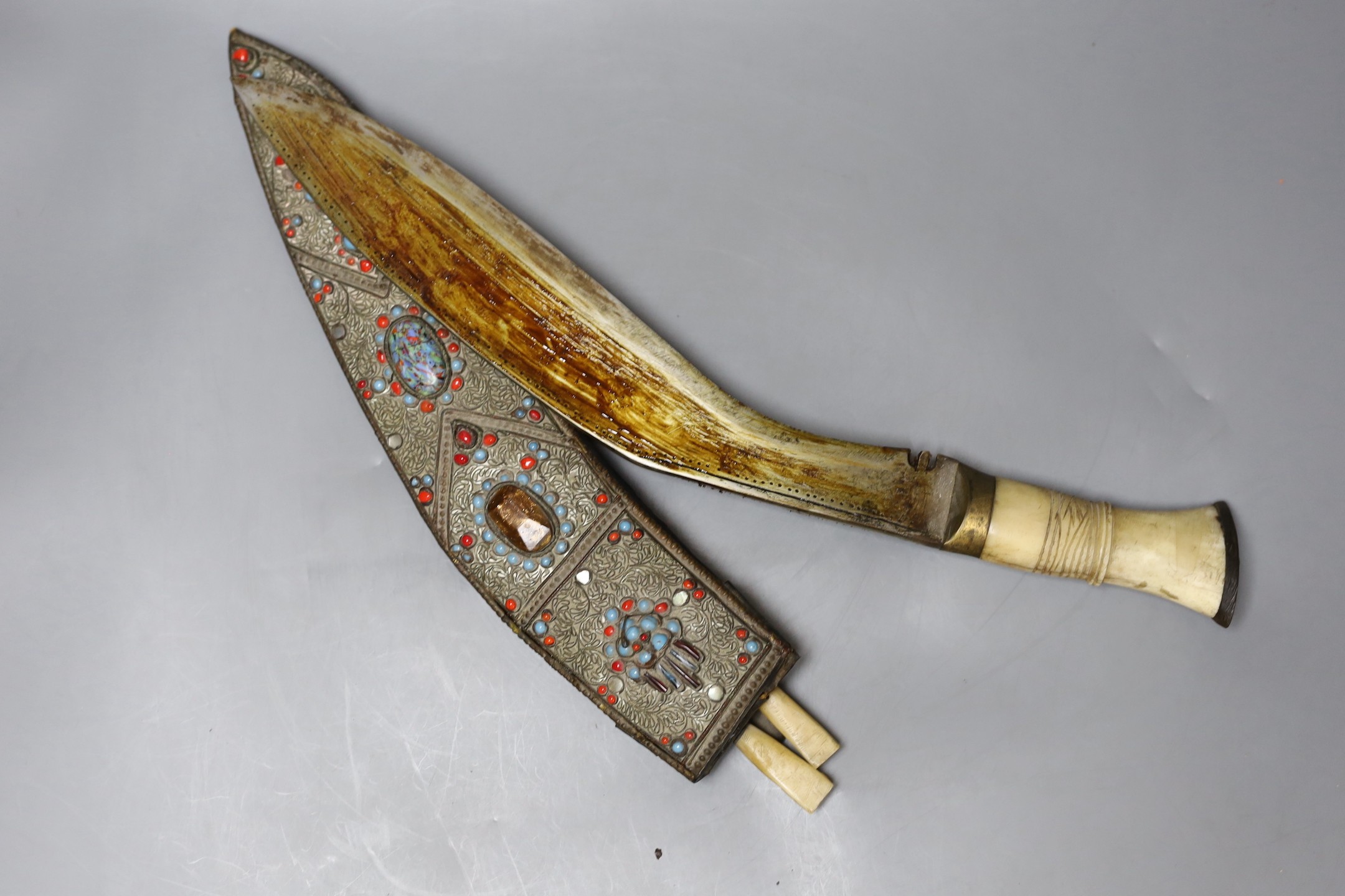 A bone handled Kukri, in paste mounted sheath, 49cm total